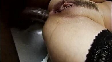 Nasty blonde gets her pussy and ass screwed on the kitchen table by two black men